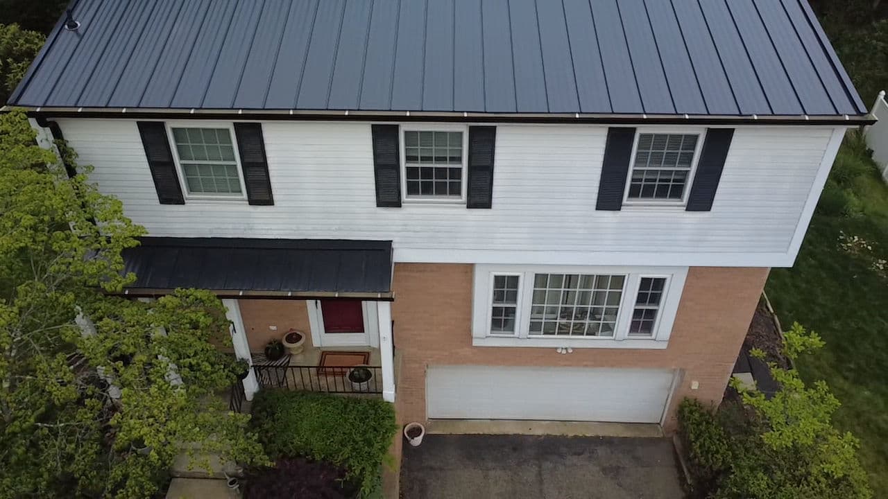 Standing Seam Metal Roof and Gutter Upgrade on a Classic Two-Story Home image