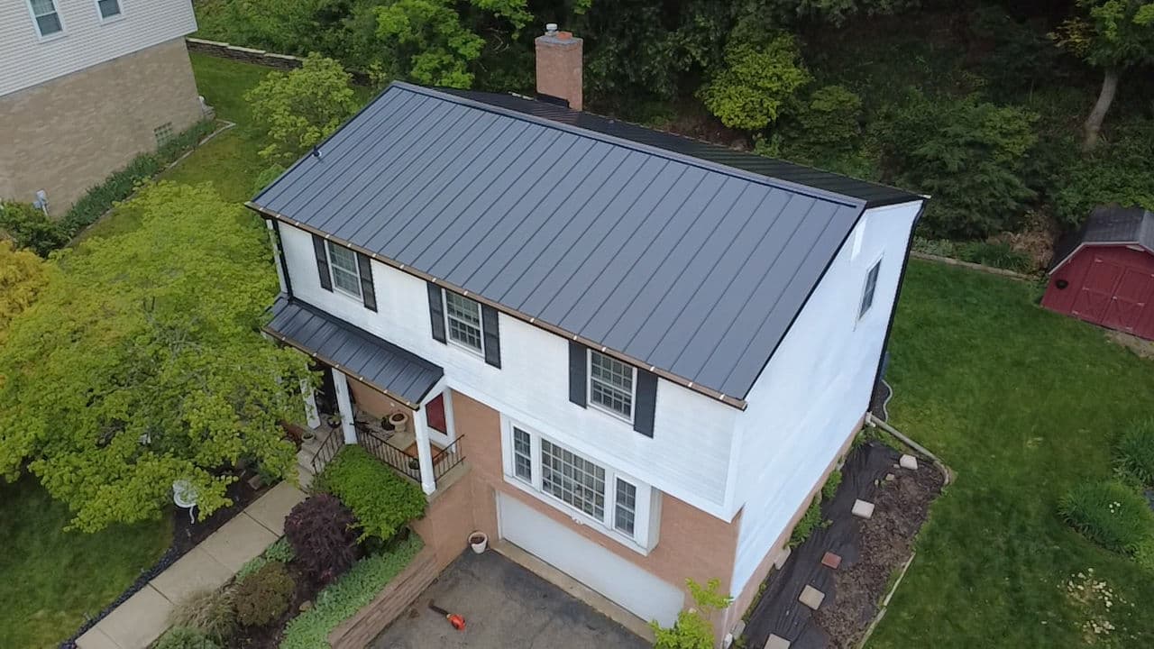 Gallery photos for Standing Seam Metal Roof and Gutter Upgrade on a Classic Two-Story Home: Image #1